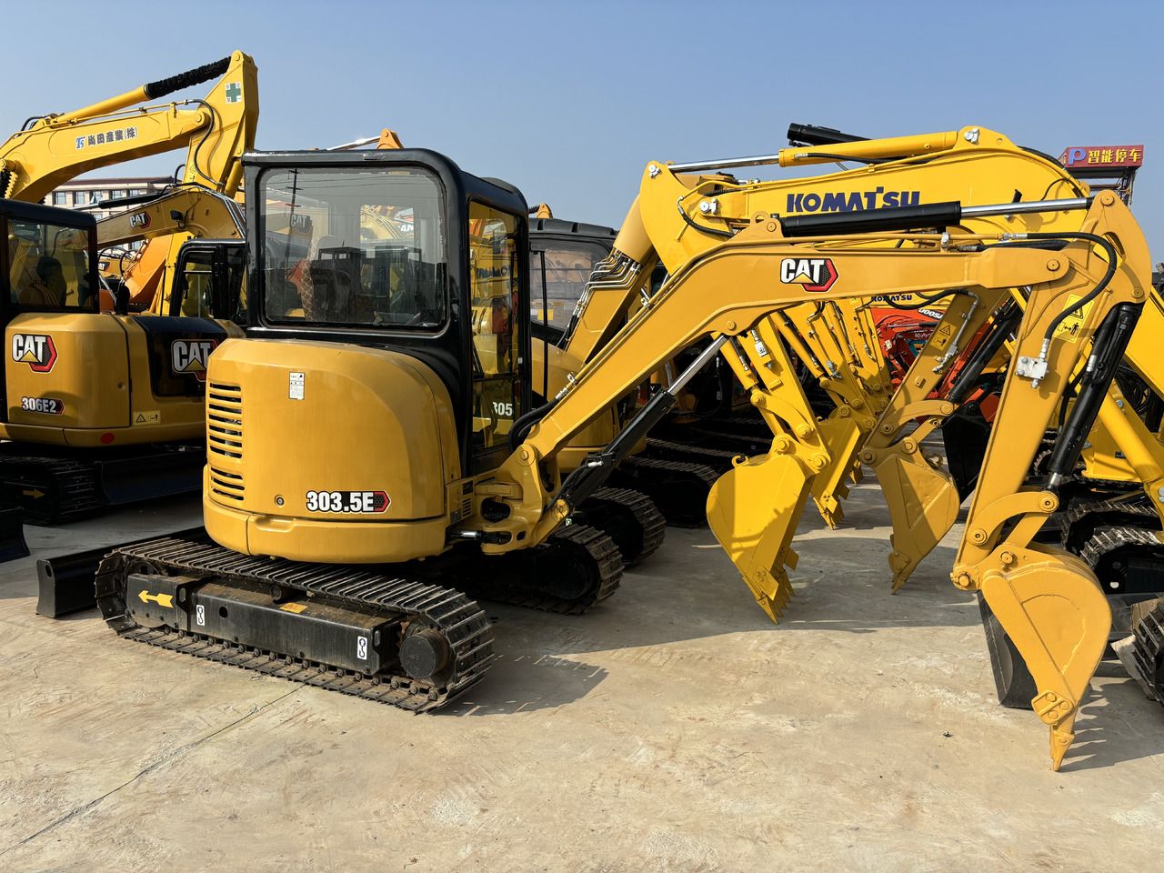 2023 Caterpillar 303.5E mini excavator, rear three-quarter view