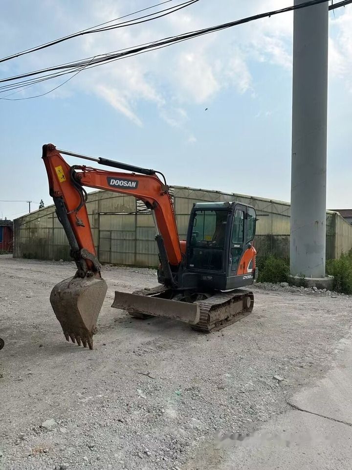 2018 Doosan DX55 mini excavator, side profile view 2018 Doosan DX55 mini excavator, side profile view