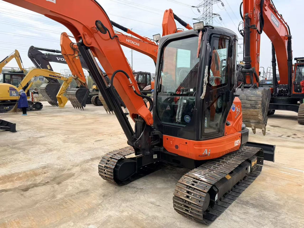 2022 Kubota KX057-4 mini excavator, front three-quarter view 2022 Kubota KX057-4 mini excavator, front three-quarter view