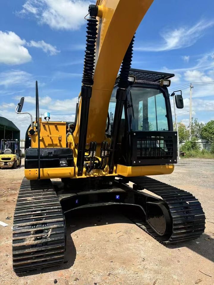 2025 Caterpillar 320D2 crawler excavator, front three-quarter view