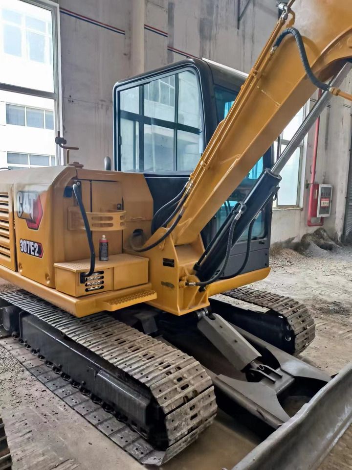 Caterpillar 307E2 mini excavator, side view