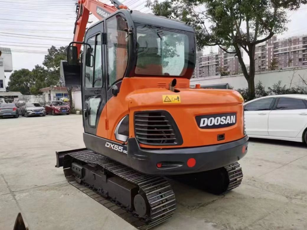 2022 Doosan DX55-9C mini excavator, rear three-quarter view