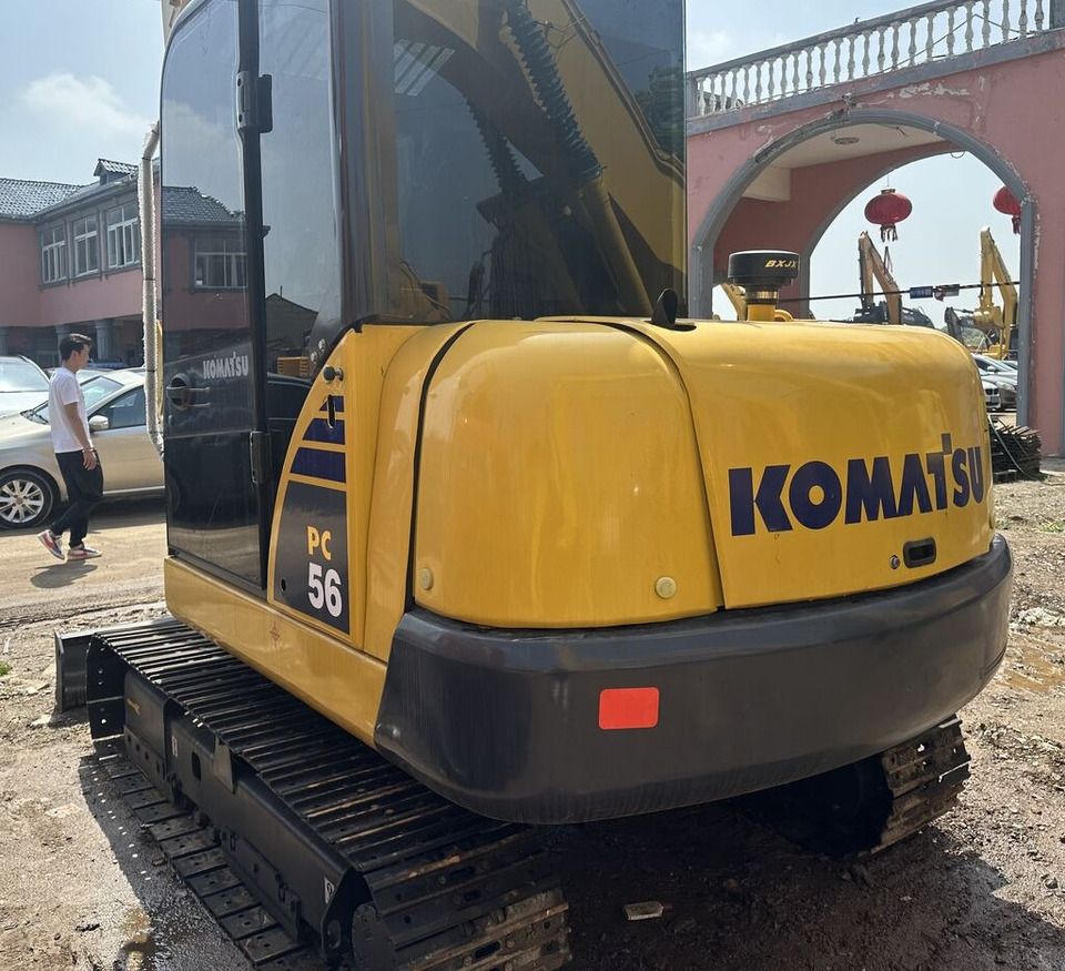 Komatsu PC56 mini excavator, rear three-quarter view Komatsu PC56 mini excavator, rear three-quarter view