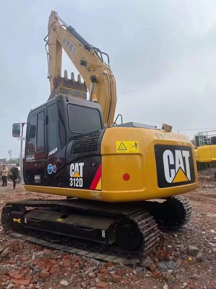 2023 Caterpillar 312D mini excavator, rear three-quarter view 2023 Caterpillar 312D mini excavator, rear three-quarter view
