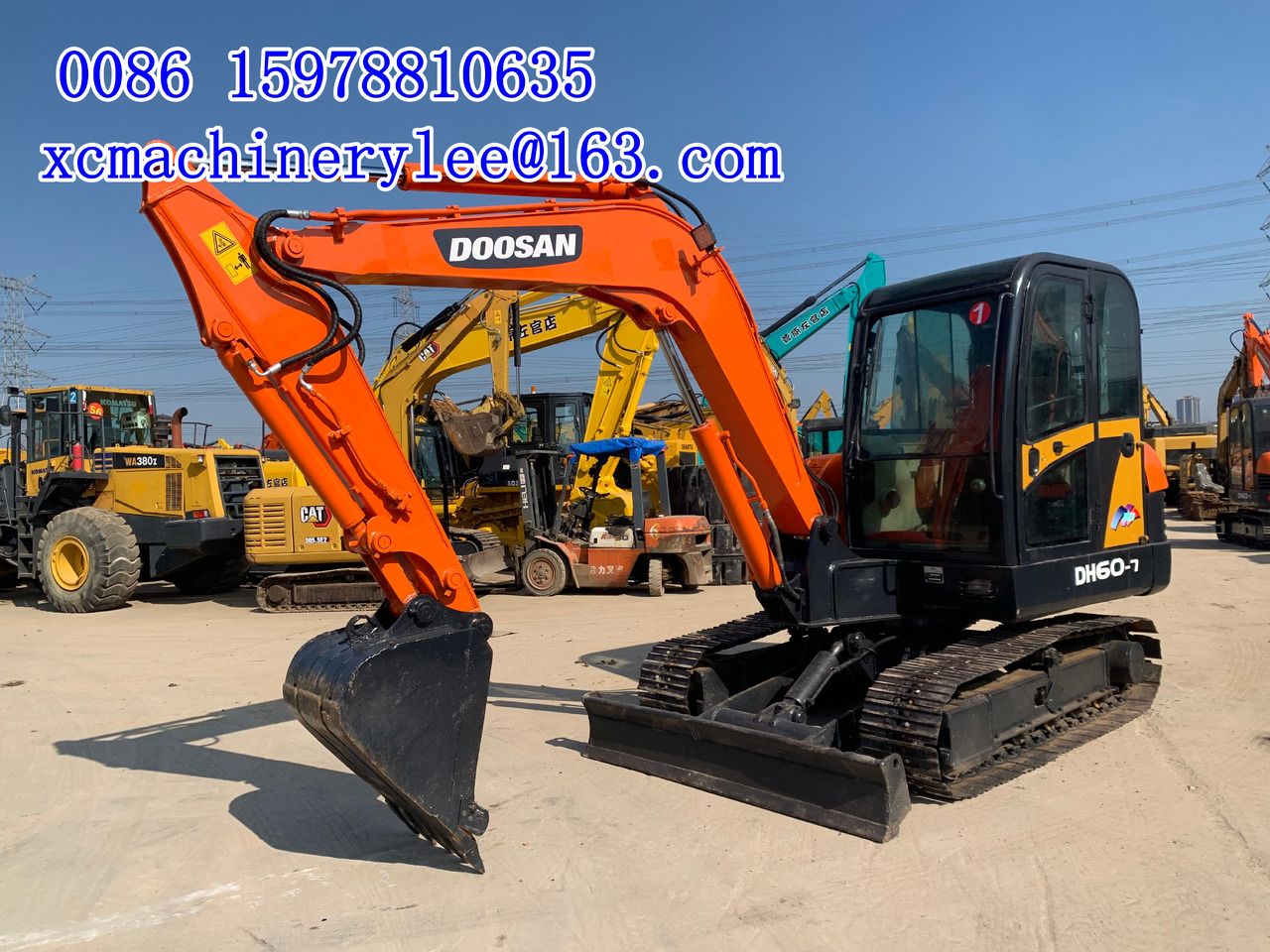 2023 MAN DX60 (Doosan DH60-7) mini excavator, side view 2023 MAN DX60 (Doosan DH60-7) mini excavator, side view