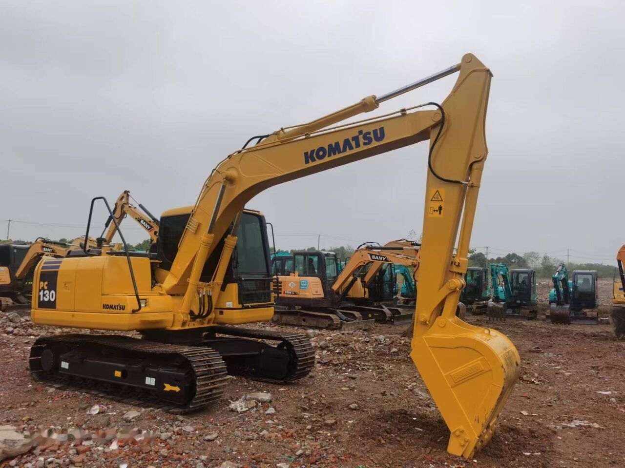 Komatsu PC130 crawler excavator, side view Komatsu PC130 crawler excavator, side view