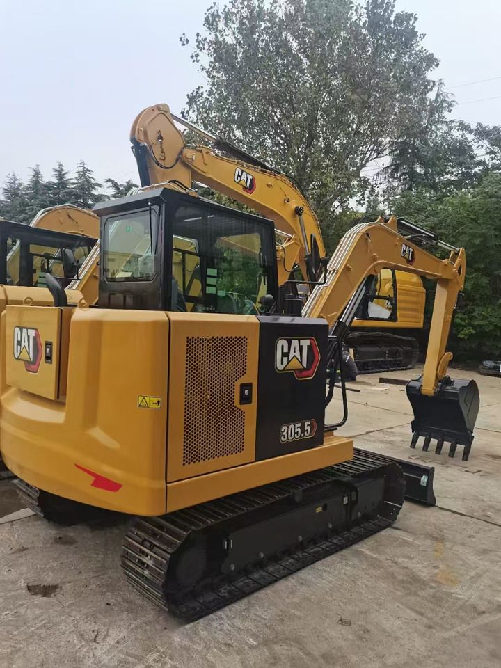 2023 Caterpillar 305.5E2 mini excavator, rear three-quarter view 2023 Caterpillar 305.5E2 mini excavator, rear three-quarter view