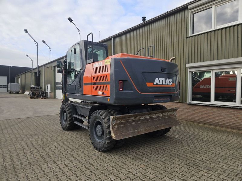 2022 Atlas 150W wheel excavator, rear three-quarter view 2022 Atlas 150W wheel excavator, rear three-quarter view