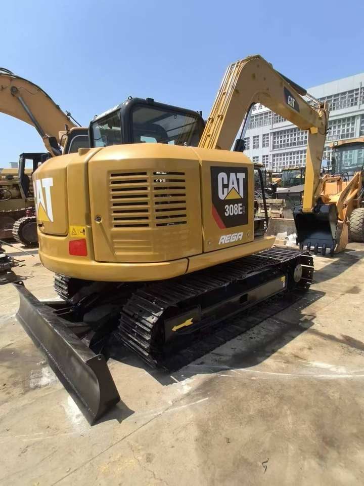 2023 Caterpillar 308E2 mini excavator, rear three-quarter view 2023 Caterpillar 308E2 mini excavator, rear three-quarter view