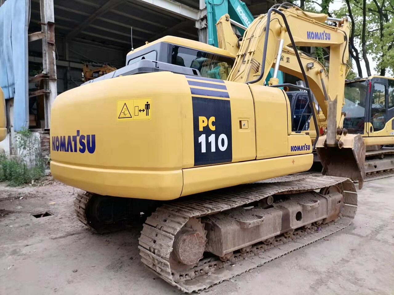 2023 Komatsu PC110-7 excavator rear three-quarter view 2023 Komatsu PC110-7 excavator rear three-quarter view