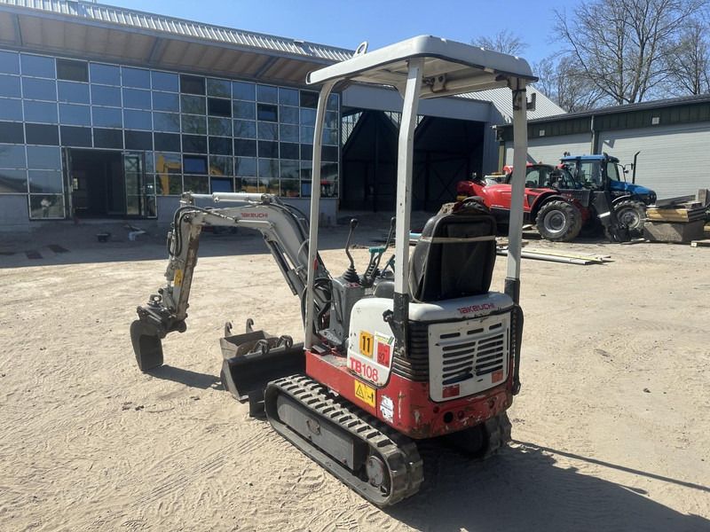 2013 Takeuchi TB108 mini excavator, rear three-quarter view 2013 Takeuchi TB108 mini excavator, rear three-quarter view