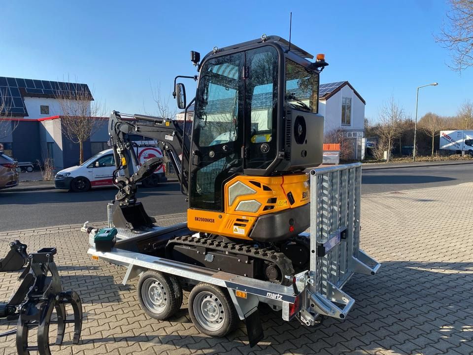 Berger Kraus BK2000NKSR mini excavator on trailer, rear three-quarter view Berger Kraus BK2000NKSR mini excavator on trailer, rear three-quarter view