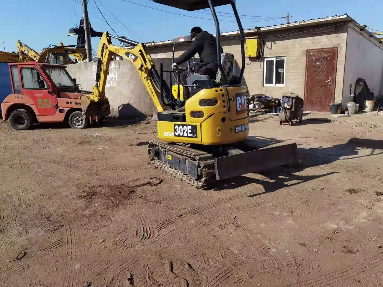 2018 Caterpillar 302EU mini excavator, rear three-quarter view 2018 Caterpillar 302EU mini excavator, rear three-quarter view