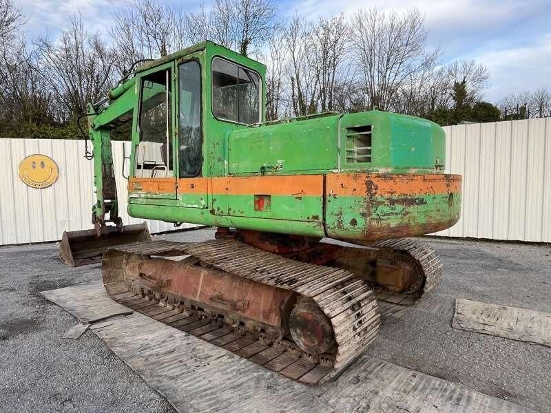 1985 Poclain 90 crawler excavator, rear three-quarter view