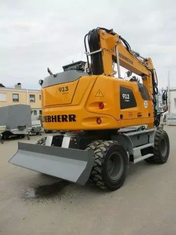 2023 Liebherr A 913 Compact wheel excavator, rear three-quarter view 2023 Liebherr A 913 Compact wheel excavator, rear three-quarter view