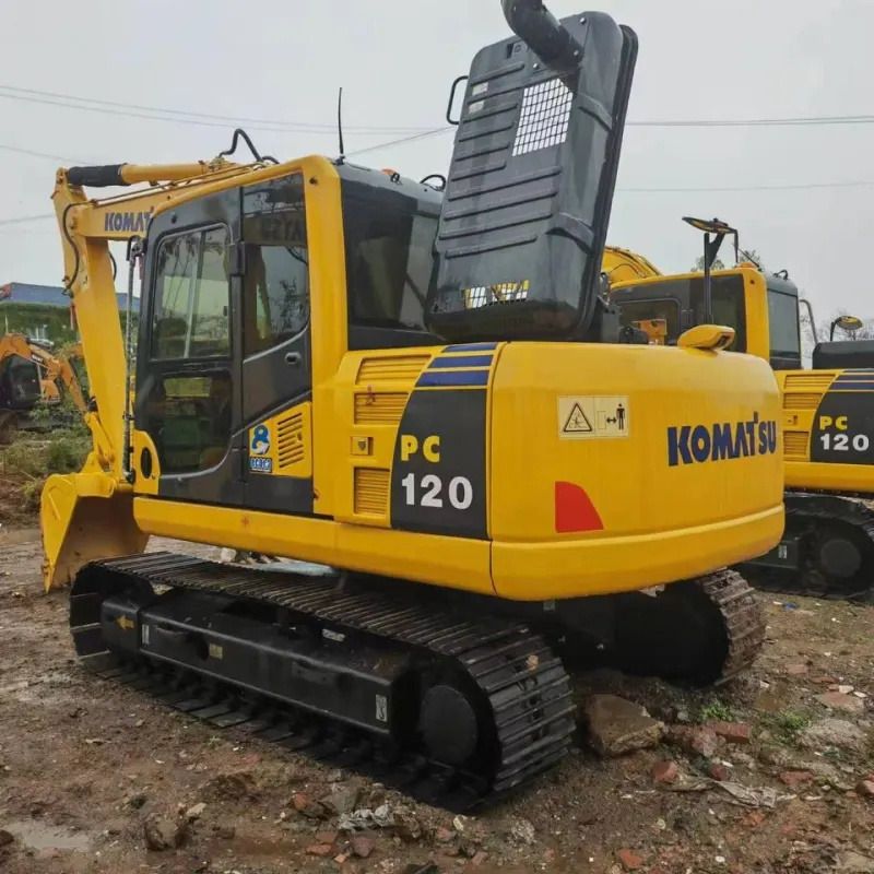 Komatsu PC120-6 crawler excavator, rear three-quarter view Komatsu PC120-6 crawler excavator, rear three-quarter view