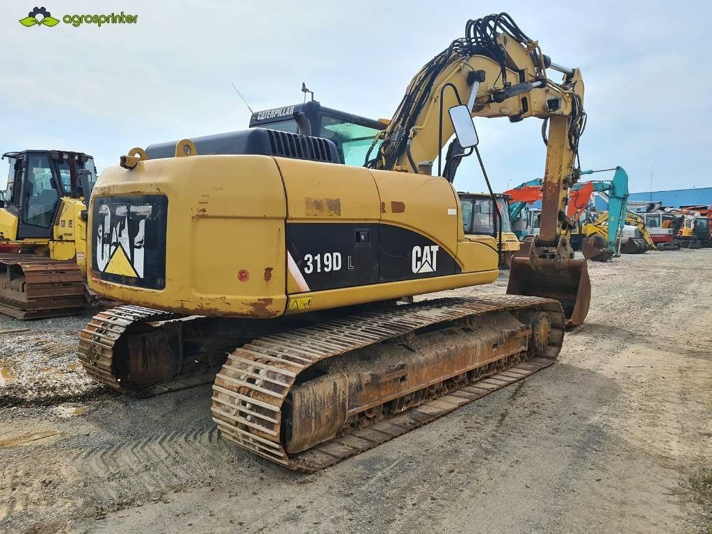 2008 Caterpillar 319DL crawler excavator, rear three-quarter view 2008 Caterpillar 319DL crawler excavator, rear three-quarter view