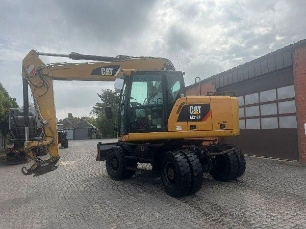 2017 Caterpillar M318F wheel excavator, side view