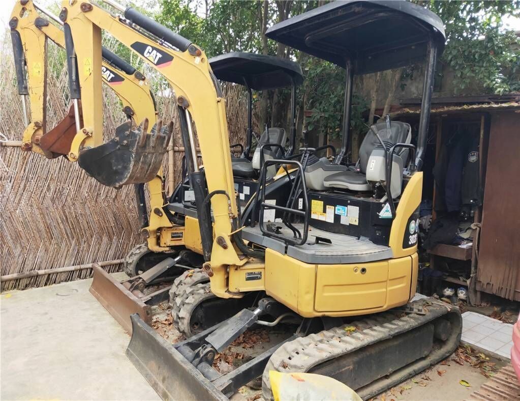 2018 Caterpillar 302C mini excavator, rear three-quarter view