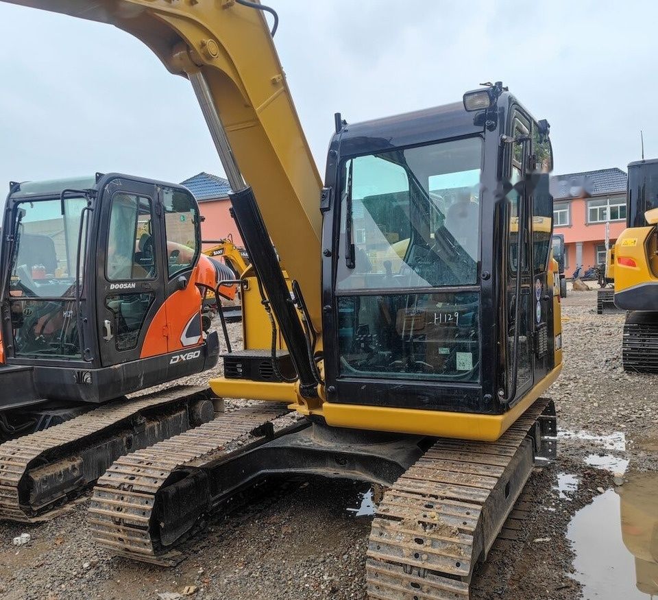 Caterpillar 307E mini excavator, front three-quarter view Caterpillar 307E mini excavator, front three-quarter view
