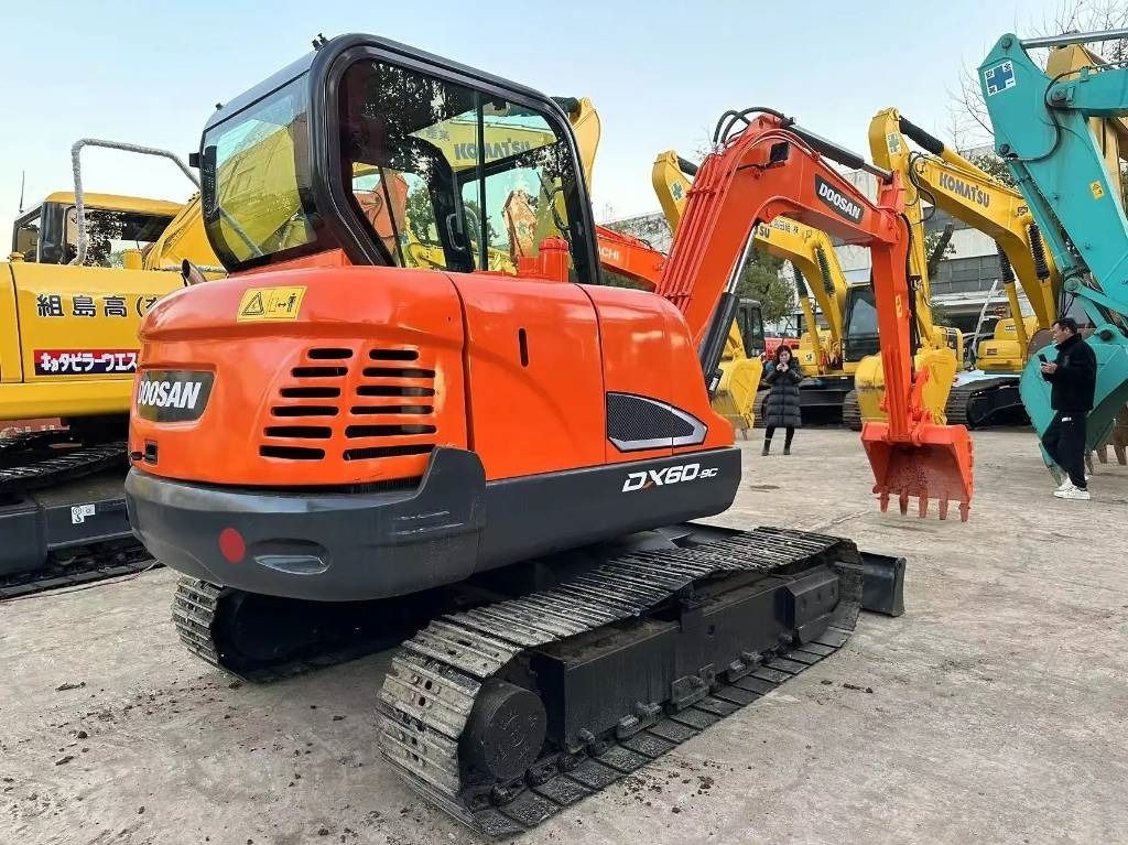 2022 Doosan DX60-9C mini excavator, rear three-quarter view 2022 Doosan DX60-9C mini excavator, rear three-quarter view