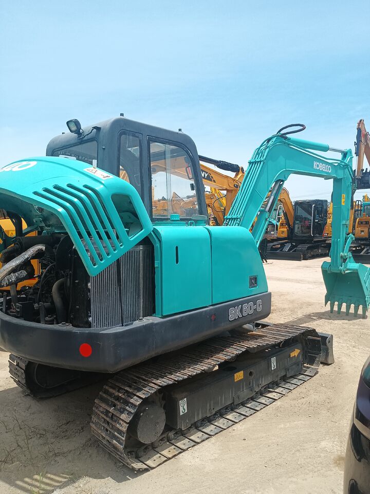 2024 Kobelco SK60-C crawler excavator, rear three-quarter view with engine cover open