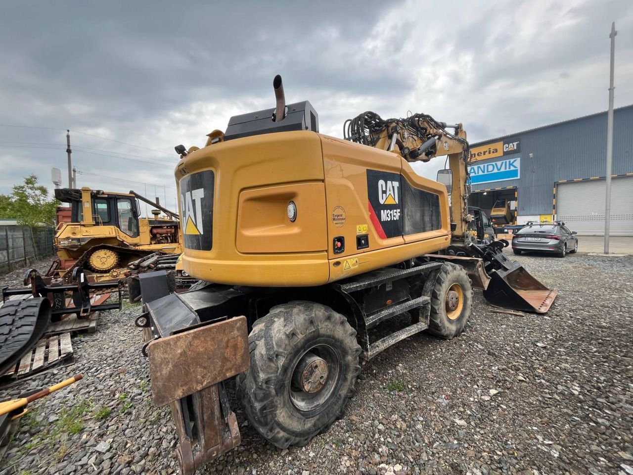 2018 Caterpillar M315F wheel excavator, rear three-quarter view