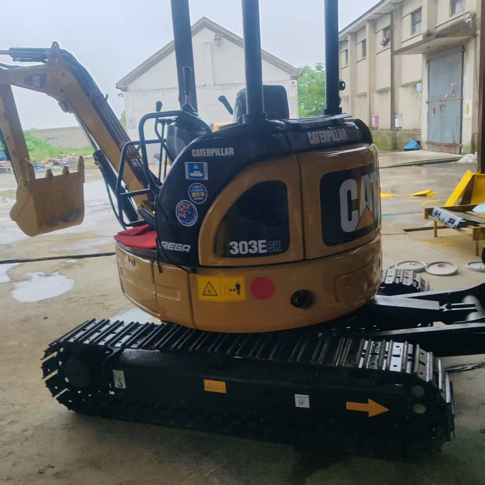 2022 Caterpillar 303E CR mini excavator, rear three-quarter view 2022 Caterpillar 303E CR mini excavator, rear three-quarter view