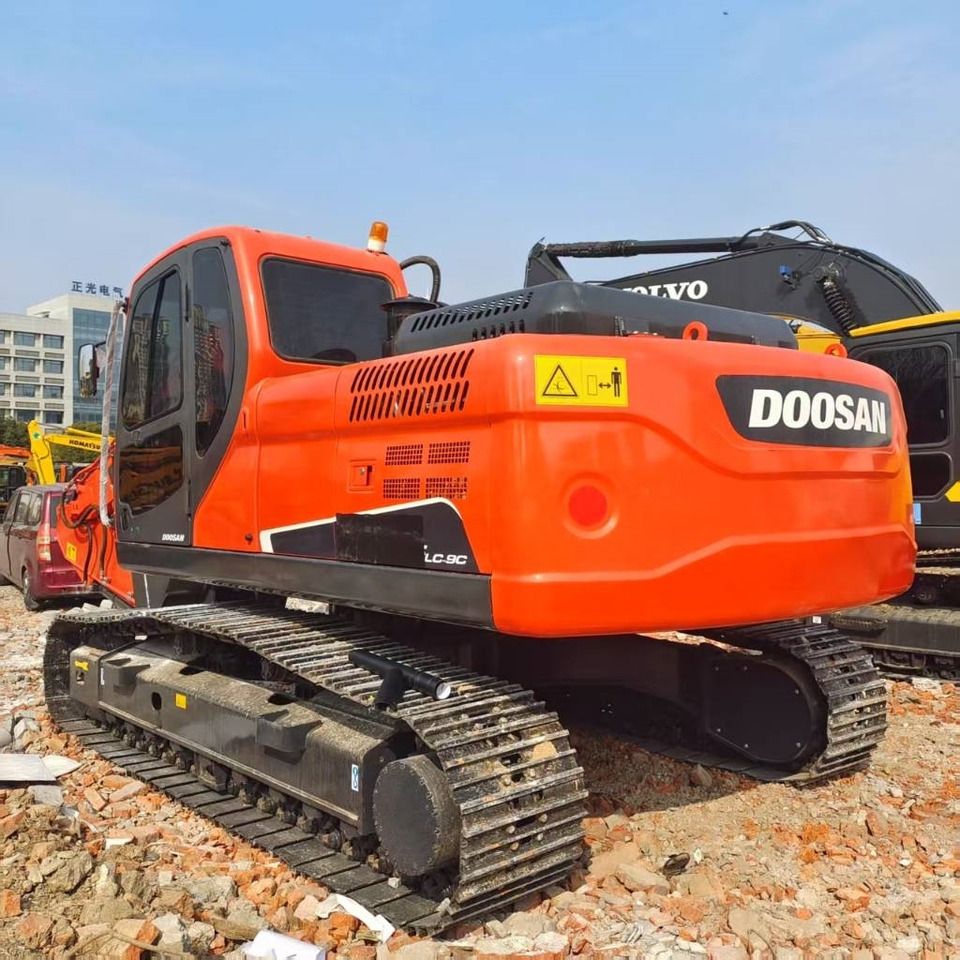 2023 Doosan DX225LC-9C excavator, rear three-quarter view 2023 Doosan DX225LC-9C excavator, rear three-quarter view