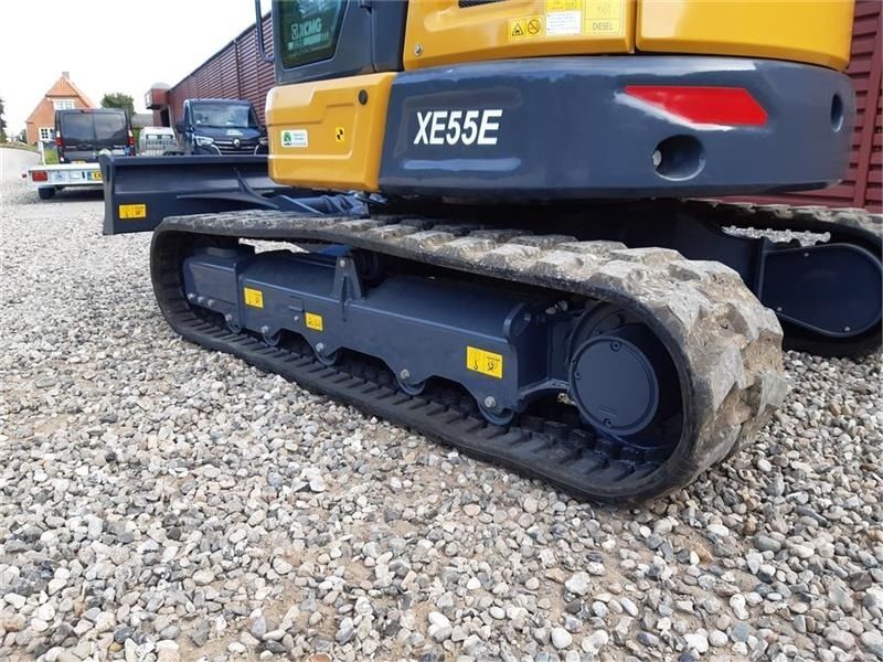 XCMG XE55E mini excavator side view of tracks and undercarriage XCMG XE55E mini excavator side view of tracks and undercarriage