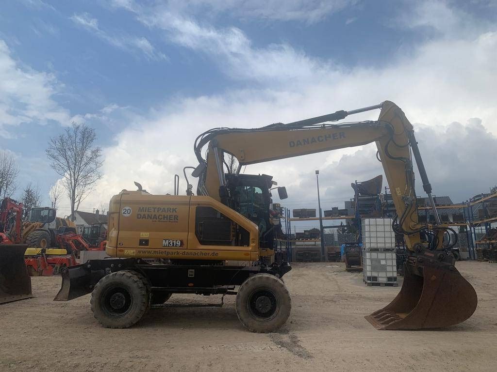 2022 Caterpillar M319-07B wheel excavator side view 2022 Caterpillar M319-07B wheel excavator side view
