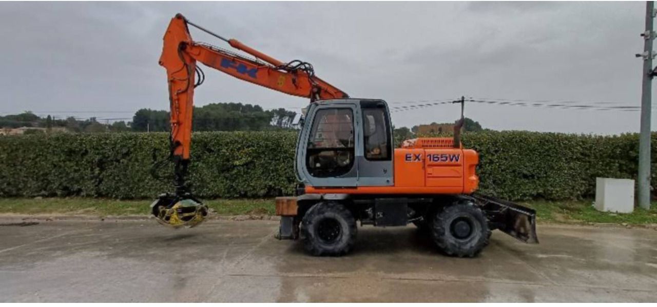 2002 New Holland EX165W wheel excavator, side profile view 2002 New Holland EX165W wheel excavator, side profile view