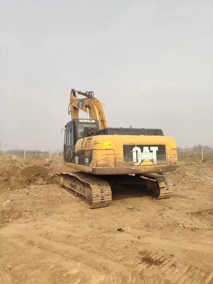 2022 Caterpillar 324D crawler excavator, rear three-quarter view