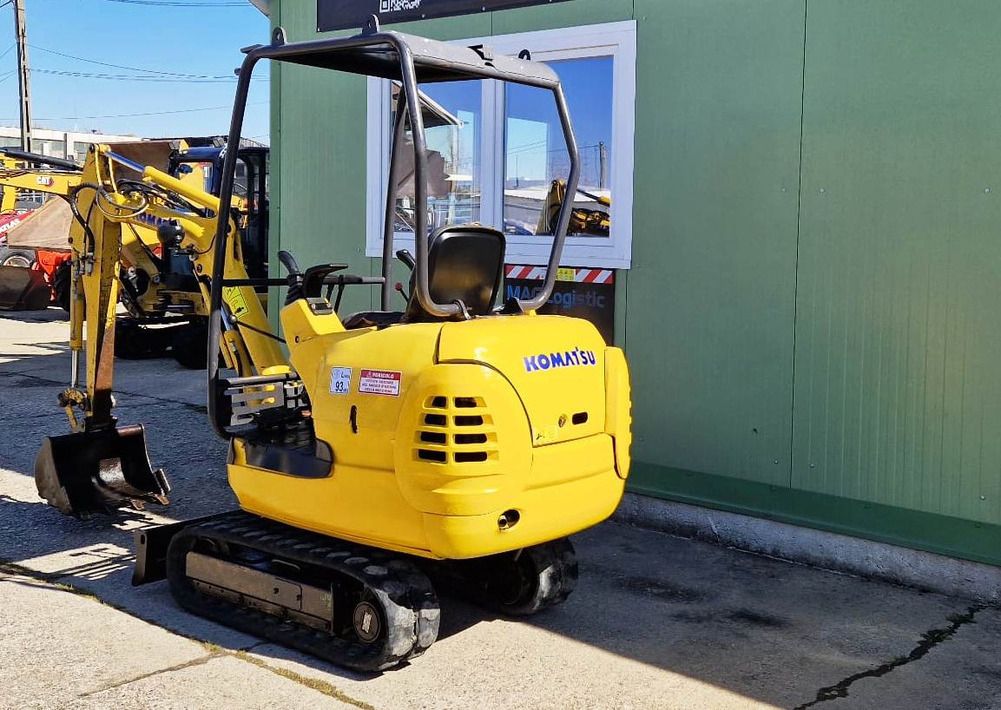 2002 Komatsu PC12R-8 mini excavator, rear three-quarter view 2002 Komatsu PC12R-8 mini excavator, rear three-quarter view