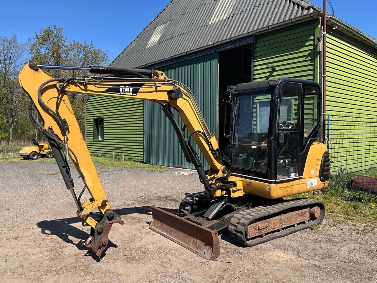 Caterpillar 303.5 mini excavator, side view Caterpillar 303.5 mini excavator, side view
