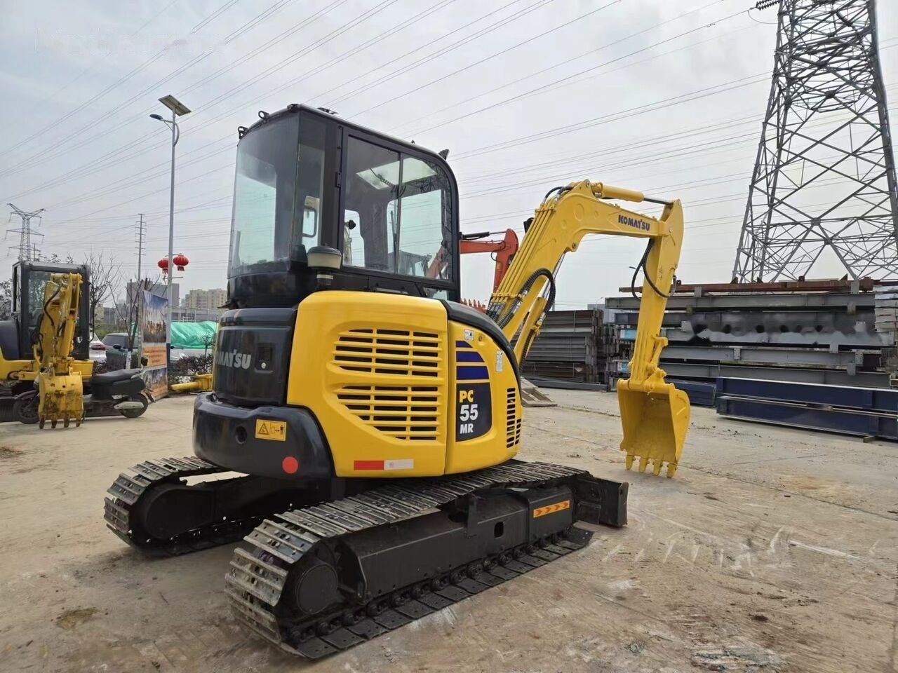 2022 Komatsu PC-55MR mini excavator, rear three-quarter view 2022 Komatsu PC-55MR mini excavator, rear three-quarter view