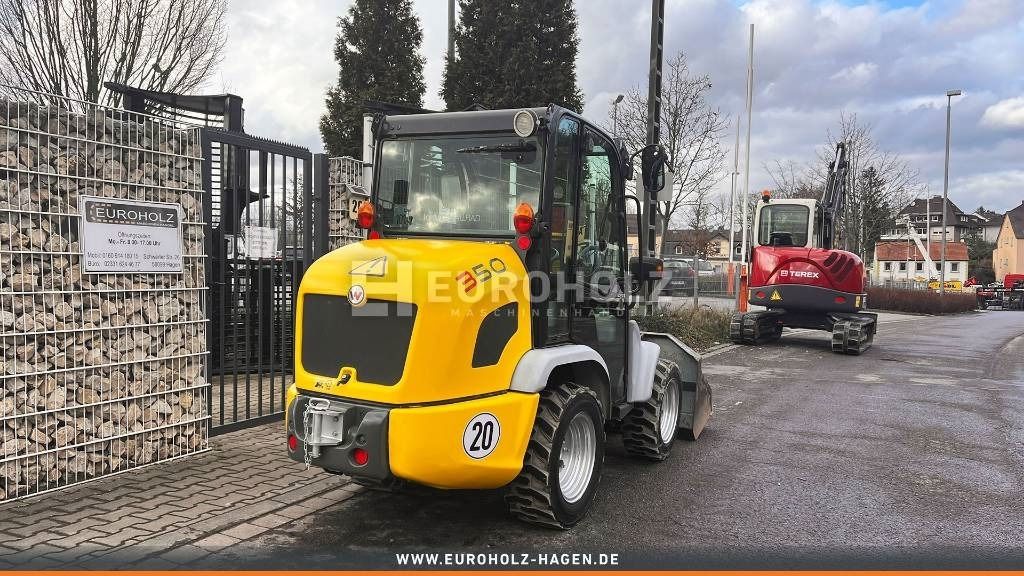 2013 Yanmar VIO25-4 mini excavator, rear three-quarter view 2013 Yanmar VIO25-4 mini excavator, rear three-quarter view