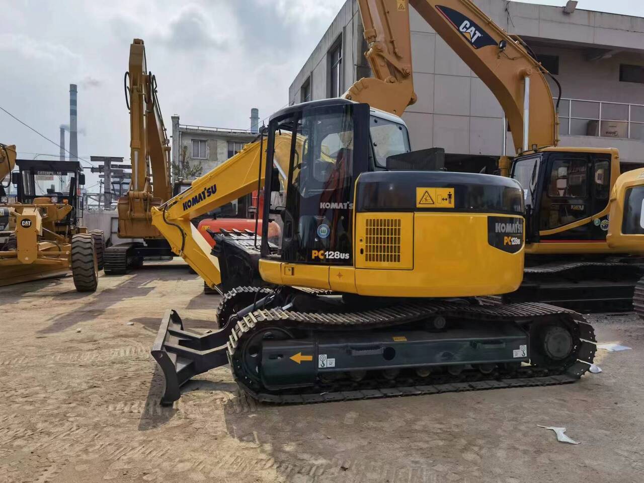 2018 Komatsu PC128US mini excavator, rear three-quarter view 2018 Komatsu PC128US mini excavator, rear three-quarter view
