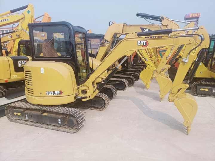 2023 Caterpillar 303.5E mini excavator, rear three-quarter view