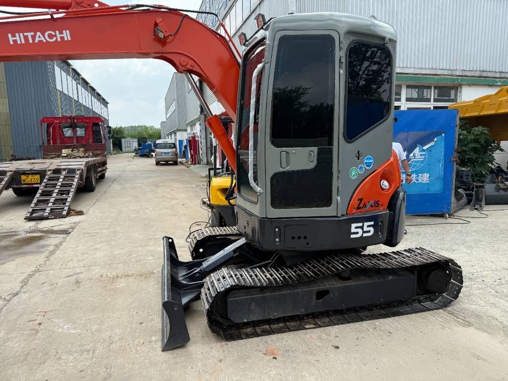 2023 Hitachi Zaxis 55 mini excavator, rear three-quarter view 2023 Hitachi Zaxis 55 mini excavator, rear three-quarter view