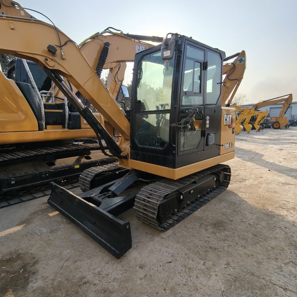 2026 Caterpillar 305.5E2 mini excavator, front three-quarter view 2026 Caterpillar 305.5E2 mini excavator, front three-quarter view