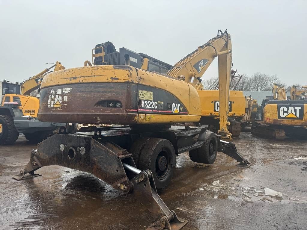2005 Caterpillar M322C material handler, rear three-quarter view