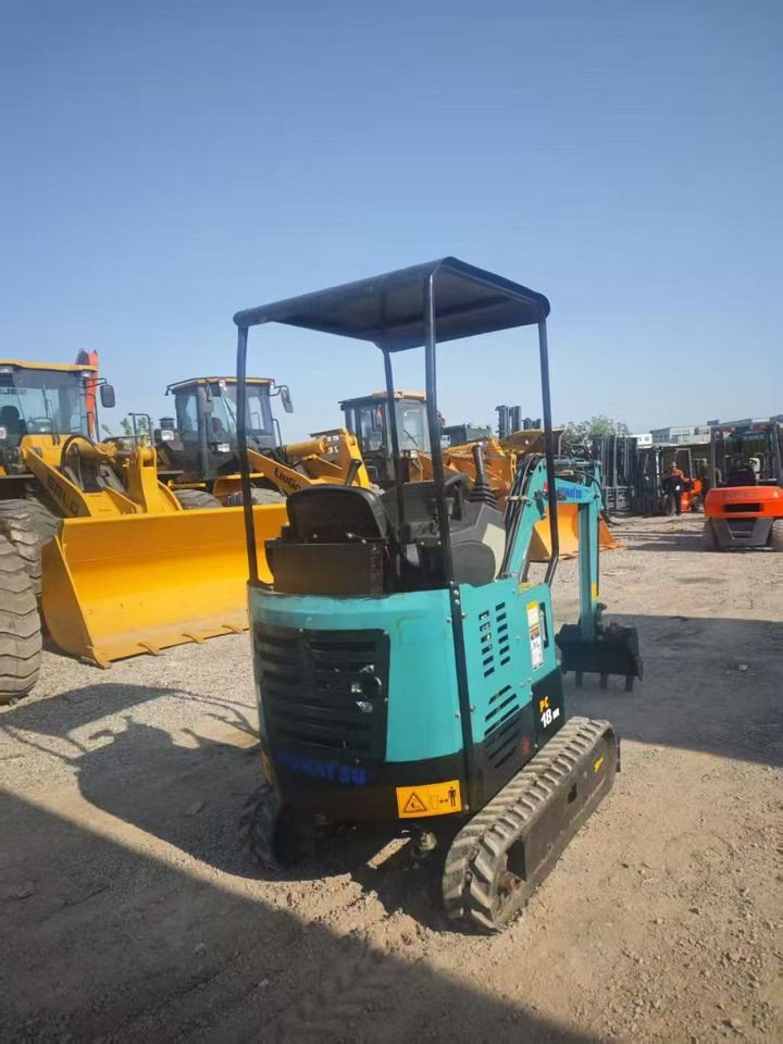 2023 Komatsu PC18 mini excavator, rear three-quarter view 2023 Komatsu PC18 mini excavator, rear three-quarter view