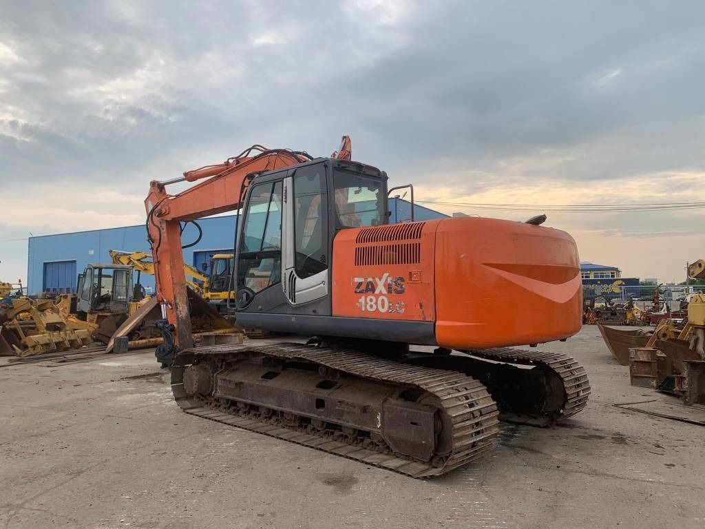 2007 Hitachi Zaxis 180 crawler excavator, rear three-quarter view 2007 Hitachi Zaxis 180 crawler excavator, rear three-quarter view