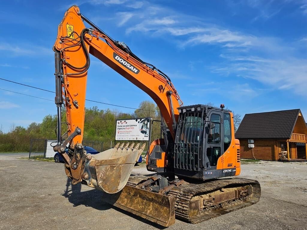 2021 Doosan DX140LCR-5 crawler excavator, front three-quarter view