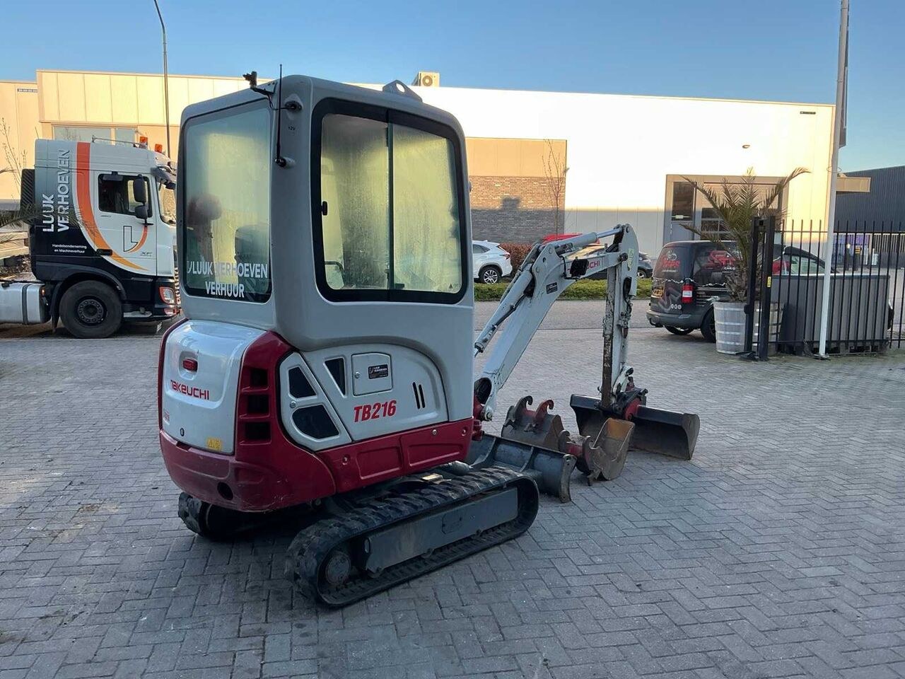 2021 Takeuchi TB216 mini excavator, rear three-quarter view