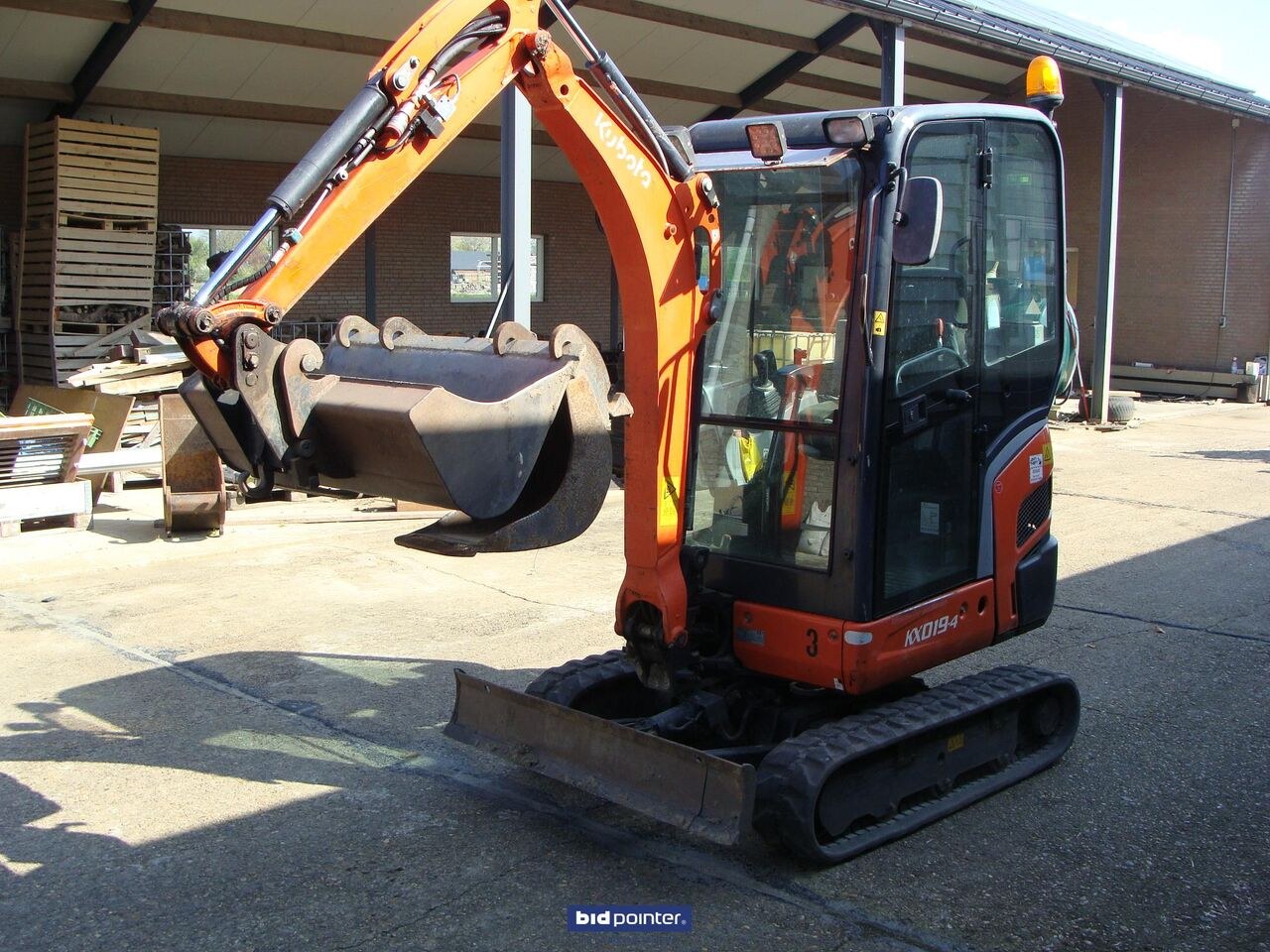 2015 Kubota KX019-4 mini excavator, front three-quarter view