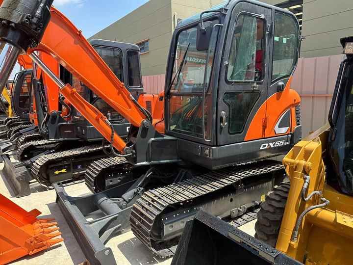 2022 Doosan DX55 mini excavator, side view 2022 Doosan DX55 mini excavator, side view