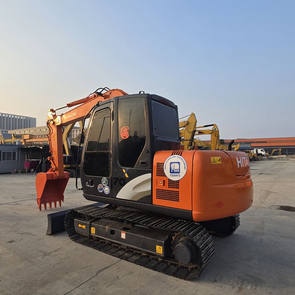 2023 Hitachi ZX70 mini excavator, rear three-quarter view 2023 Hitachi ZX70 mini excavator, rear three-quarter view