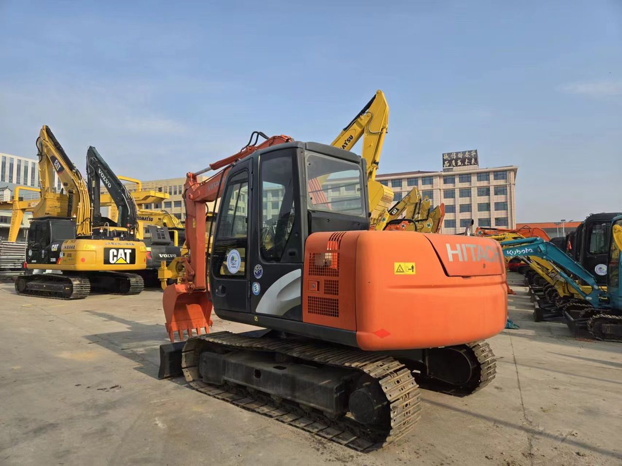 2022 Hitachi ZX60 mini excavator, rear three-quarter view 2022 Hitachi ZX60 mini excavator, rear three-quarter view